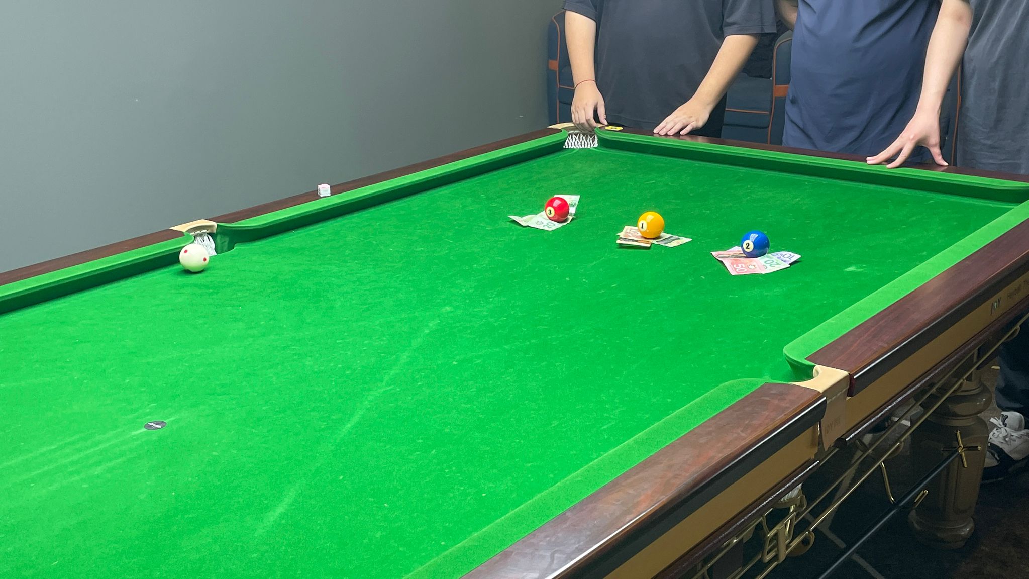 Jack at his first pool tournament, cue in hand beside the table.